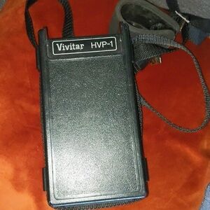 Vivitar HVP-1 battery pack with strap